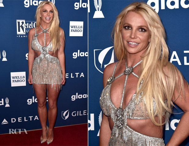 Britney spears in a silver dress on the red carpet.