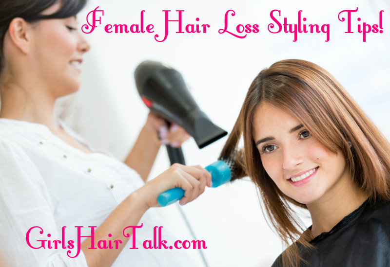 Women smiling getting her hair blow dried from a hairstylist.